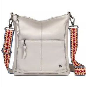 Sak Lucia cream purse with guitar strap crossbody